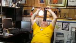 Longest Time To Balance Two Golf Drivers On Top Of 12 Hockey Pucks On Forehead