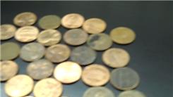 Tallest Penny Tower Stacked With Two Hands In One Minute