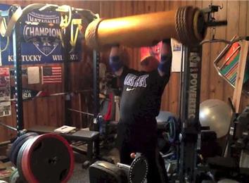 Most Overhead Presses Using A 185-Pound Wooden Log