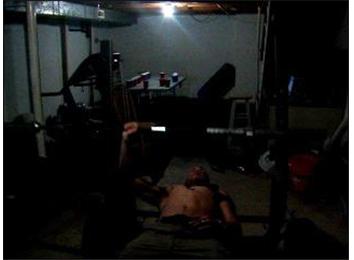 Most One-Arm Bench Press Repetitions With A 45-Pound Bar