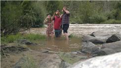 Most People Drinking Beer While Standing In A River