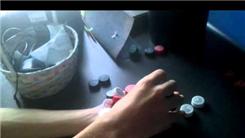 Most Coca-Cola Bottle Caps Held In Hand At Once