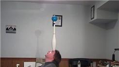 Longest Time To Balance A Juggling Club By The Body With A Four-Inch Stage Ball On Top On Forehead While Kneeling