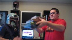 Most Graphic Novels Balanced On Someone's Head In 30 Seconds While Wearing A Boba Fett Helmet