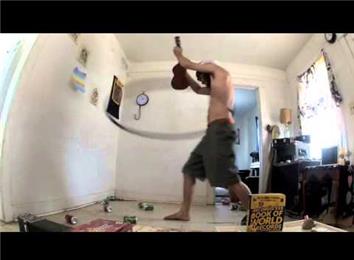 Most Hula Hoop Rotations While Playing Ukelele And Singing The Refrain To The Hula Hoop Song