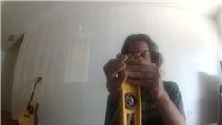 Longest Time Balancing Three Mini-Bic Lighters On Top Of A 24-Inch Level On Fingertip