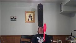 Most Catches Juggling Three Clubs While Balancing A Skateboard On Forehead And Kneeling
