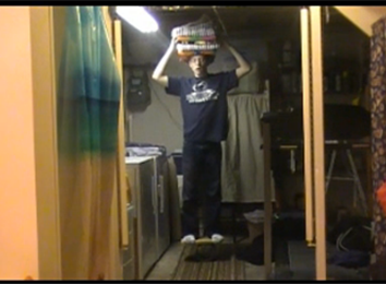 Most Towels Balanced On Head While Balancing On A Rola Bola