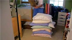 Highest Stack Of Pillows Sat On