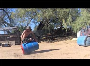 Fastest Time To Stand Up And Tip Over A Barrel Three Times While Balancing On The Barrel