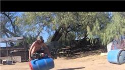Fastest Time To Stand Up And Tip Over A Barrel Three Times While Balancing On The Barrel