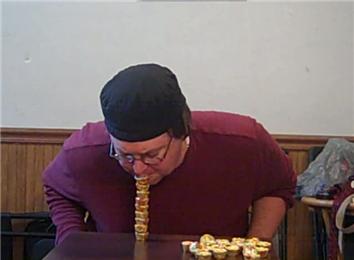 Tallest Mini Reese\'s Peanut Butter Cups Tower Using Mouth