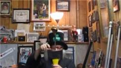 Longest Time Balancing Seven Golf Balls On Top Of A Golf Club And Two Bowie Knives On Top Of A Double-Bitted Axe On Chin