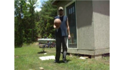 Most Behind-The-Back Bounces Of A Basketball Off The Side Of A Building From Six Feet Away In One Minute