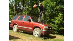 Most Basketball Dribbles In One Minute While Standing On The Hood Of An SUV In 30 Seconds