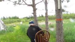Fewest One-Armed Rifle Shots To Hit Five Balloons From 50 Yards Away While Seated