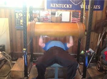 Most Reps Bench Pressing A 165-Pound Wooden Log 