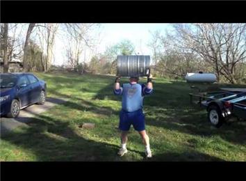 Most Overhead Presses Using A 152-Pound Keg
