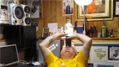 Longest Time To Balance A Bottle Of Water On Top Of Five Hockey Pucks On Forehead