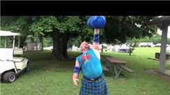 Most Reps Pressing A 111-Pound Dumbbell With Left Arm While Wearing A Kilt