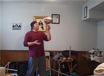 Most Charlier Cuts In One Hand While Spinning An American Football On Other Hand