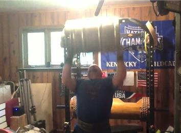 Most Overhead Presses Using A 78-Pound Keg
