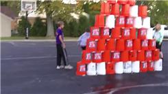 Tallest Five-Gallon Bucket Pyramid On An Outdoor Basketball Court