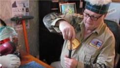 Tallest Penny Tower Stacked On Top Of A Hammer Handle