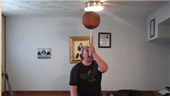Most Two-Handed Charlier Card Cuts While Spinning A Basketball On A Mouthstick