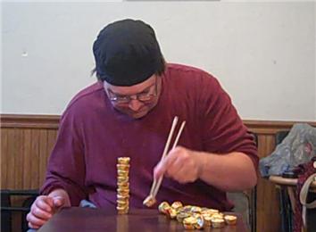 Tallest Mini Reese\'s Peanut Butter Cups Tower Using Chopsticks