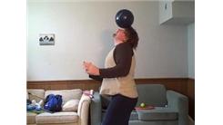 Most Times Throwing A Bowling Ball Onto Forehead, Balancing It, Rolling It To Neck, And Bouncing It Back To Front Of Body In One Minute