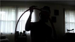Longest Time Juggling Three Two-Pound Balls Overhead And Hula Hooping While Kneeling