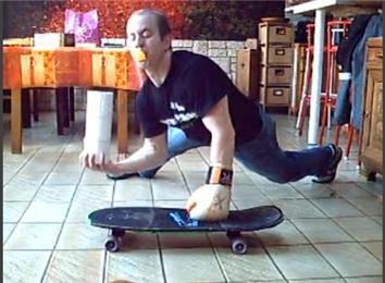 Most One-Armed Push-Ups On A Skateboard While Wearing A Glove, Balancing Three Toilet Paper Rolls And Balancing A Table Tennis Ball On A Spoon Held By Mouth