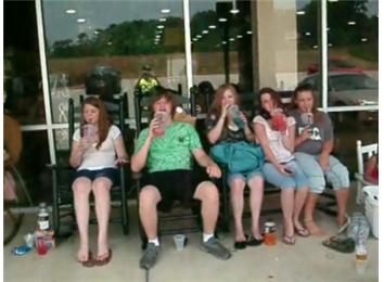 Largest Group Rocking In Rocking Chairs While Drinking QT Slushies