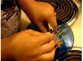 Most Toothpicks Stuck In A Lil Smoky Sausage In 30 Seconds