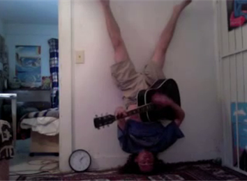Longest Headstand While Playing The Guitar