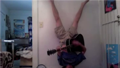 Longest Headstand While Playing The Guitar