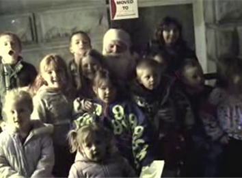 Most People Posing For Photos With Santa In A Bus Stop Shelter