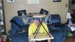 Longest Time To Balance A Hardwood Stool On Top Of A Hardwood Table On Chin While Kneeling