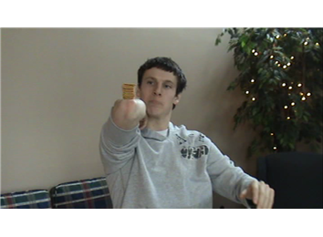 Most Wheat Thins Balanced On Elbow And Caught