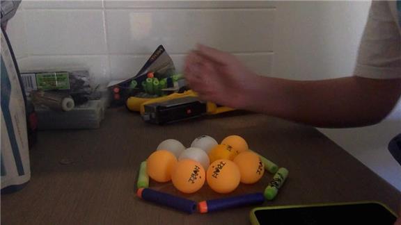 Most Table Tennis Balls Held in the Hand in 5 Seconds