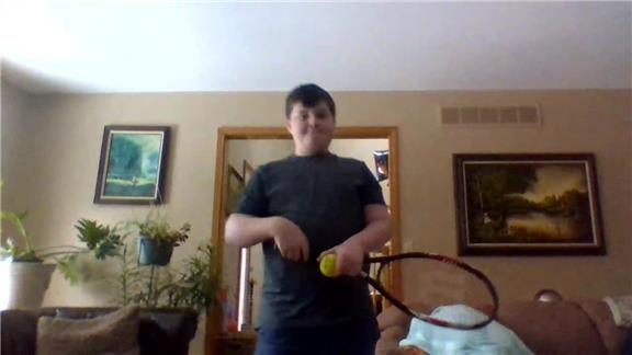Most Tennis Ball Bounces On A Tennis Racquet By A 12-Year-Old