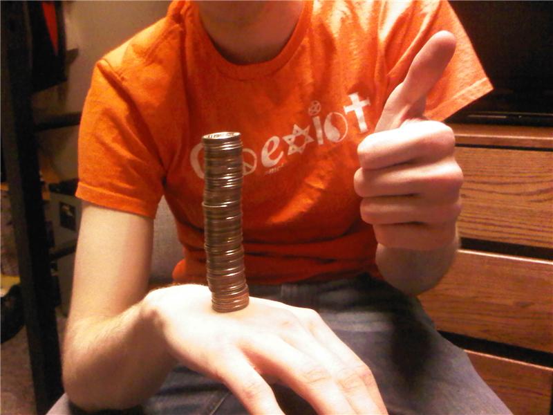 Most Quarters Balanced On Hand