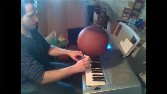 Longest Time to Play a Song on Piano With Both Hands While Holding a Pen With a Basketball Spinning on It