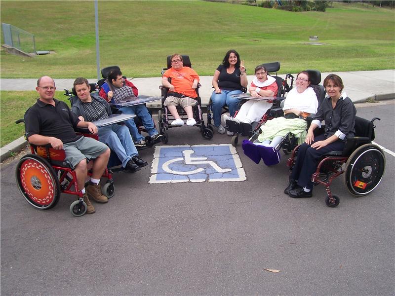 Largest Group Of People In Wheelchairs In A Disabled Parking Space At Once