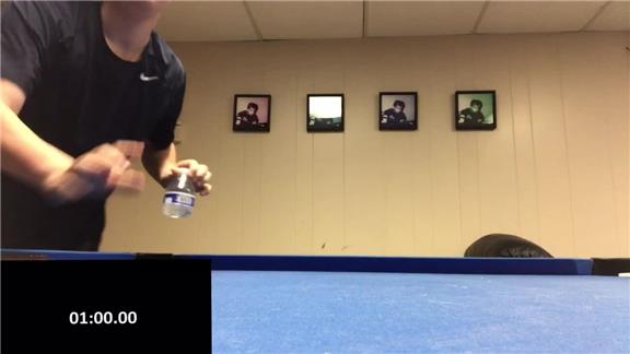 Most Water Bottle Flips Onto A Table In One Minute