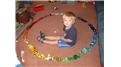 Largest Toy Car Circle Built Around A 3-Year Old