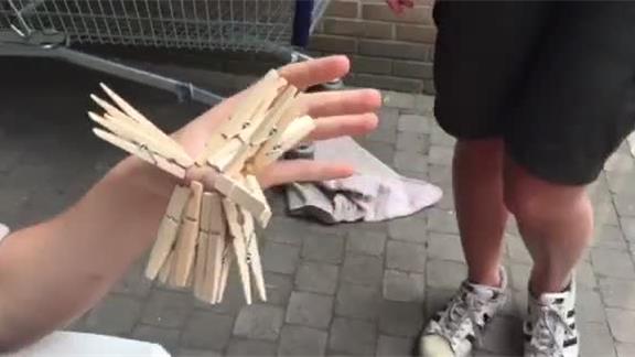Most Clothespins Attached To Thumb