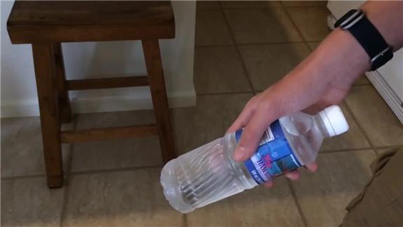 Most Half Rotations of a Water Bottle While Alternating Hands