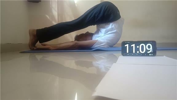 Longest Holding in Halasana Plow Pose 